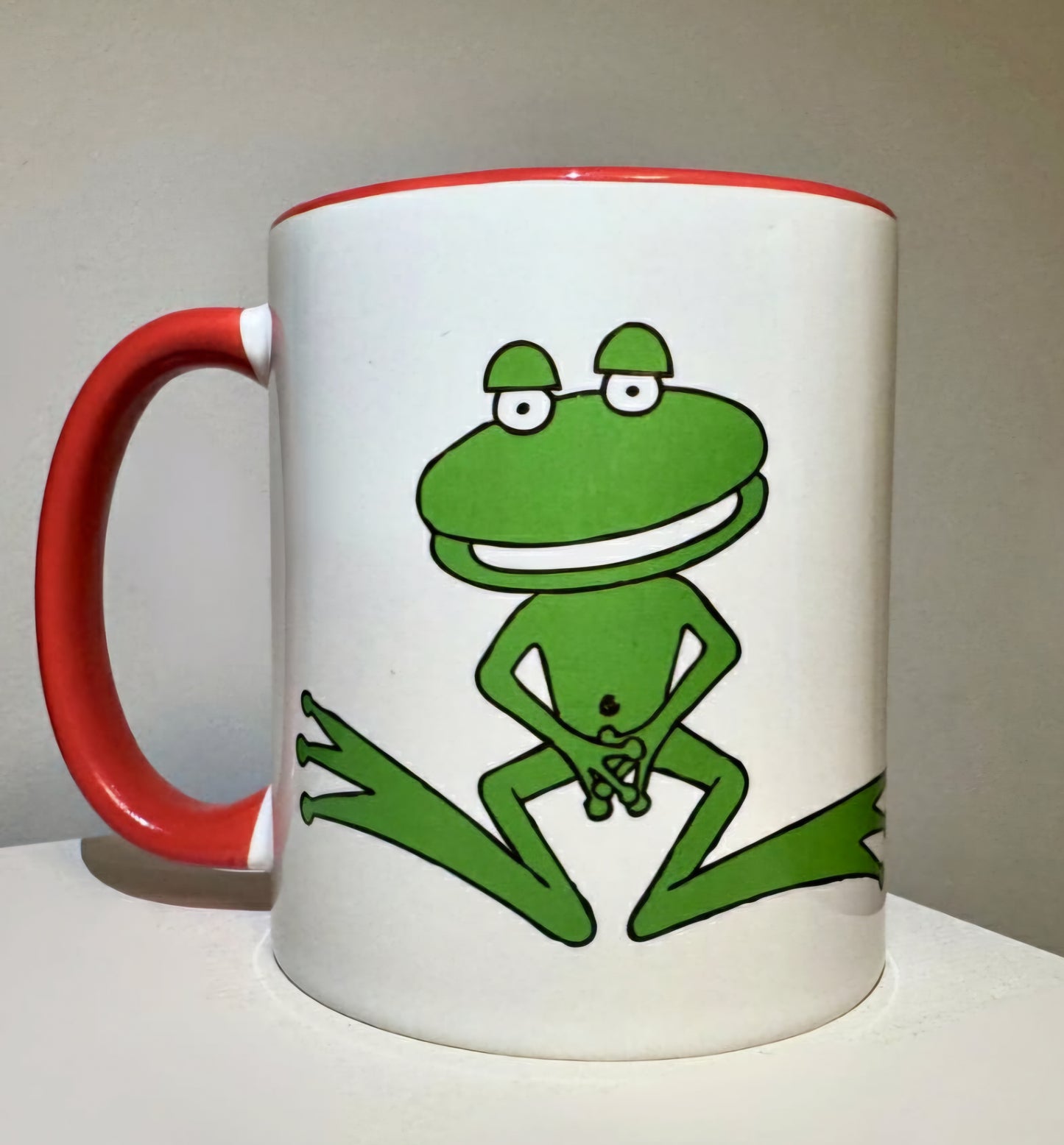 Nude frog mug